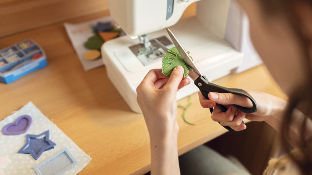 close-up-woman-cutting-leaf